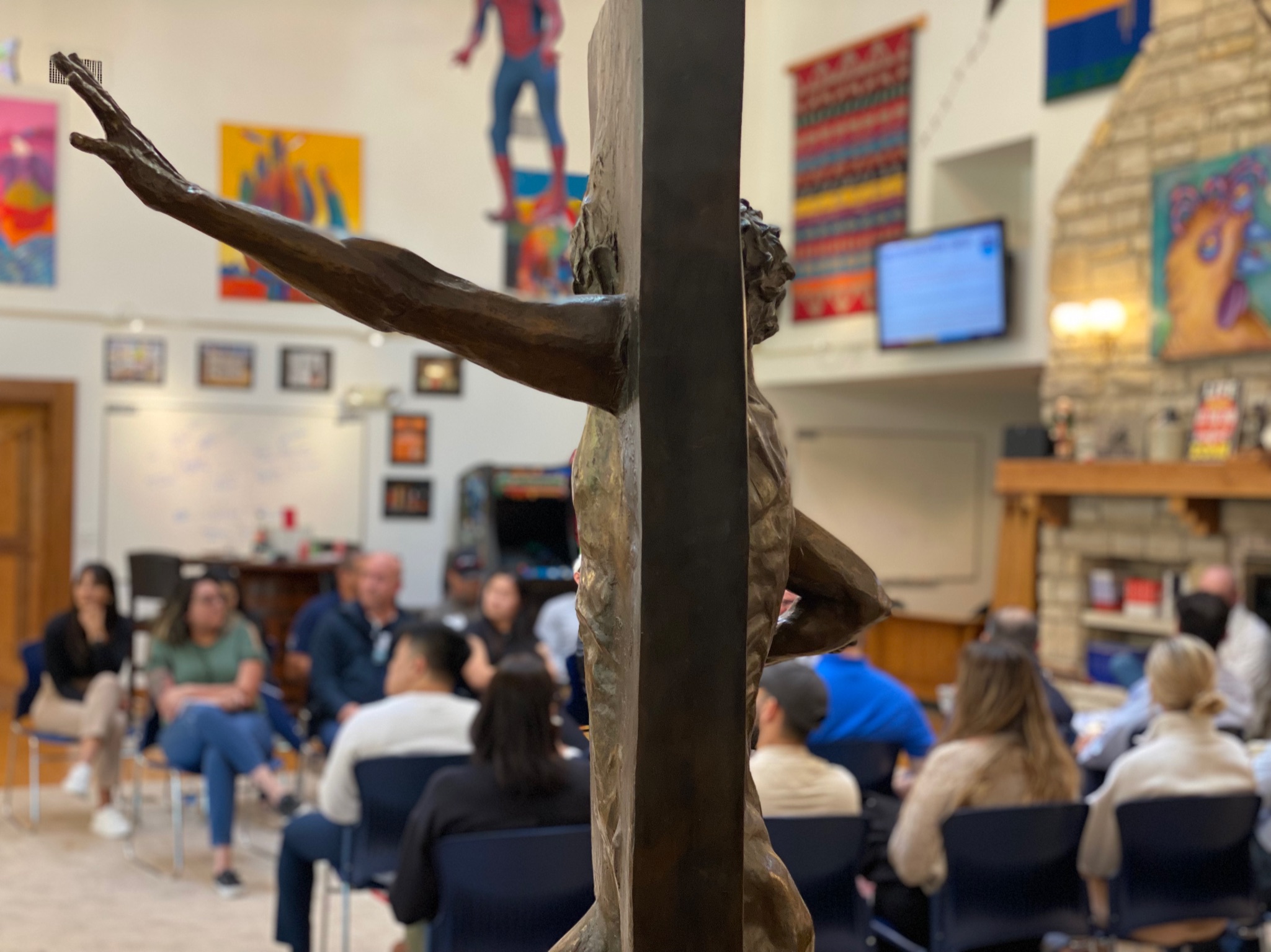 Team working with a creative art piece during an innovation session at Eureka Ranch