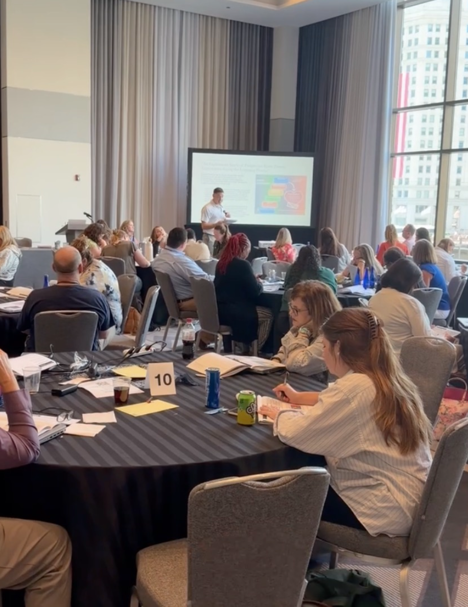 Conference room during a spark deck presentation on Day 1